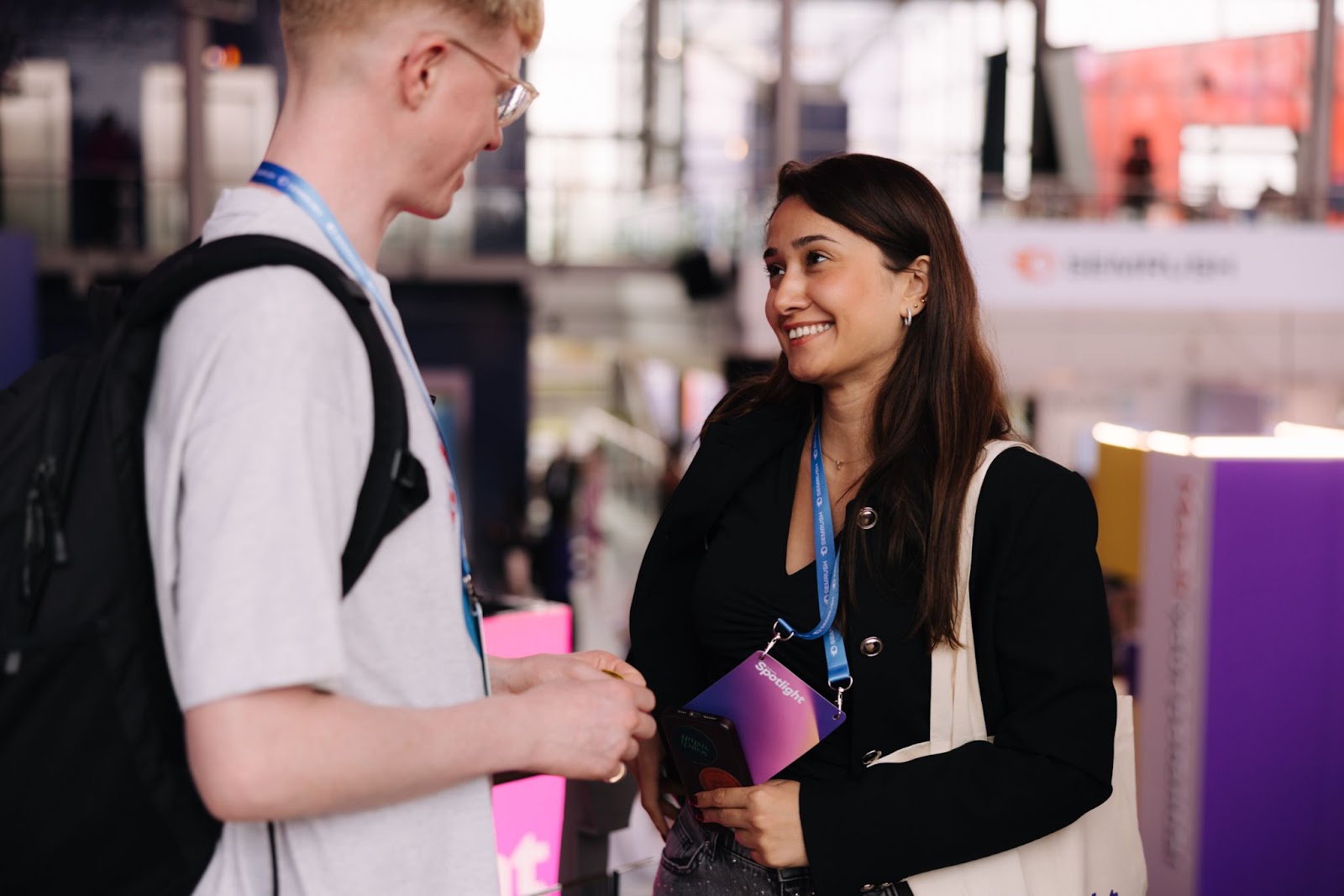two people having a conversation at the event